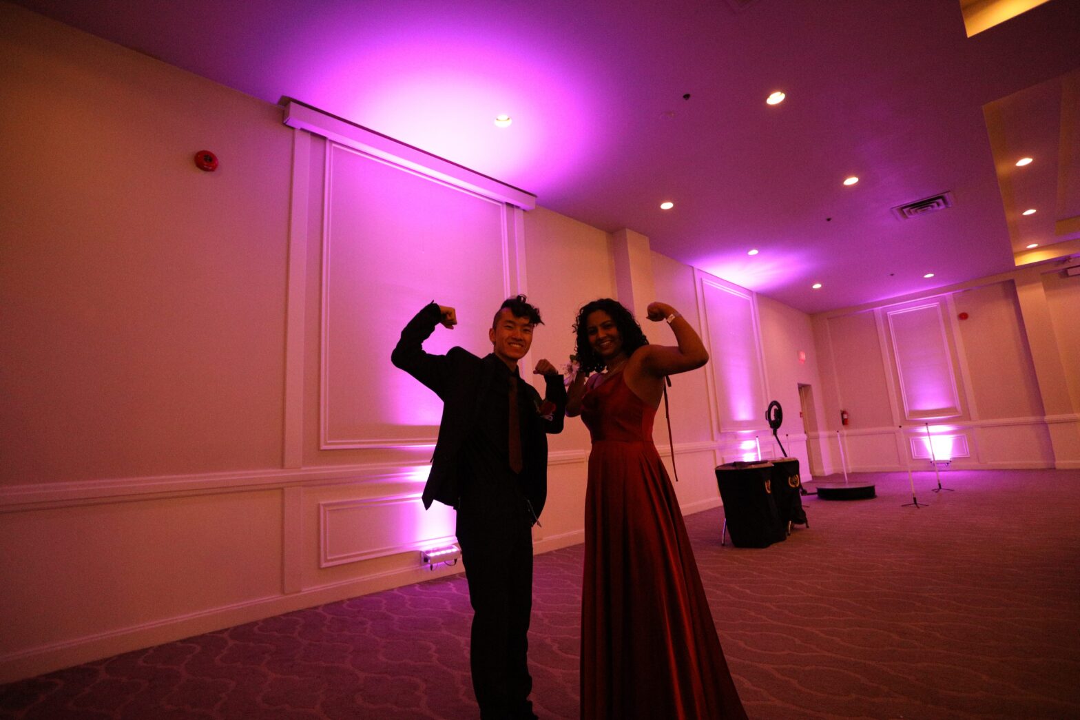 Praevalli and her boy best friend posed flexing their biceps at prom.