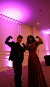 Praevalli and her boy best friend posed flexing their biceps at prom.