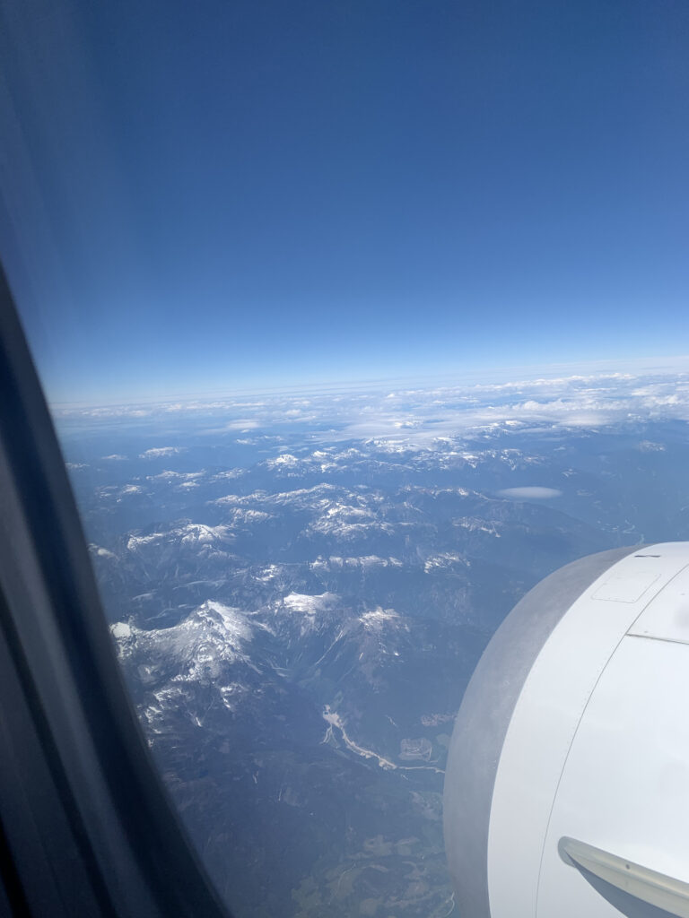 British Columbia snowcapped mountains and clouds taken from a plane.